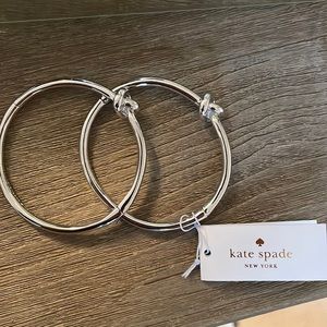 2 Kate Spade Love Me Knot bracelets. Never been worn.